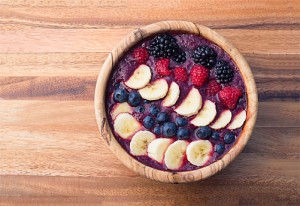 berry acai smoothie bowl with bananas, blueberries, raspberries and blackberries